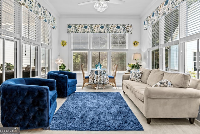 living room with tile patterned flooring, crown molding, and ceiling fan