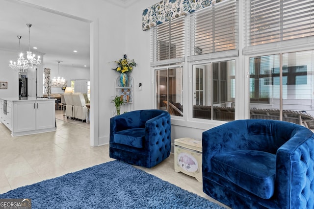 sitting room featuring an inviting chandelier, crown molding, and light tile patterned flooring