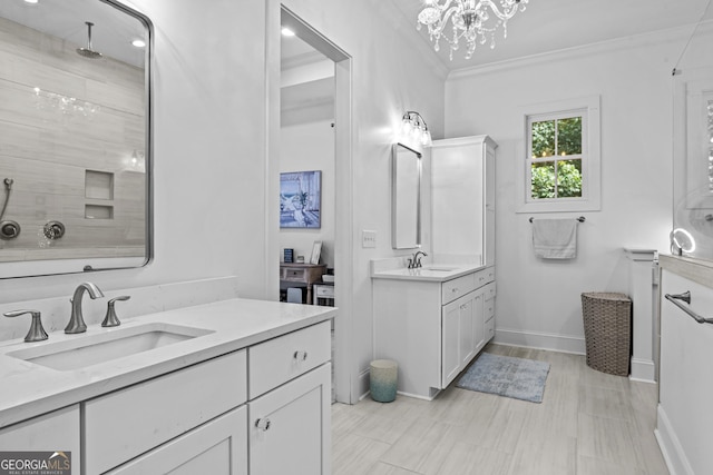 bathroom with vanity, crown molding, a chandelier, and a shower