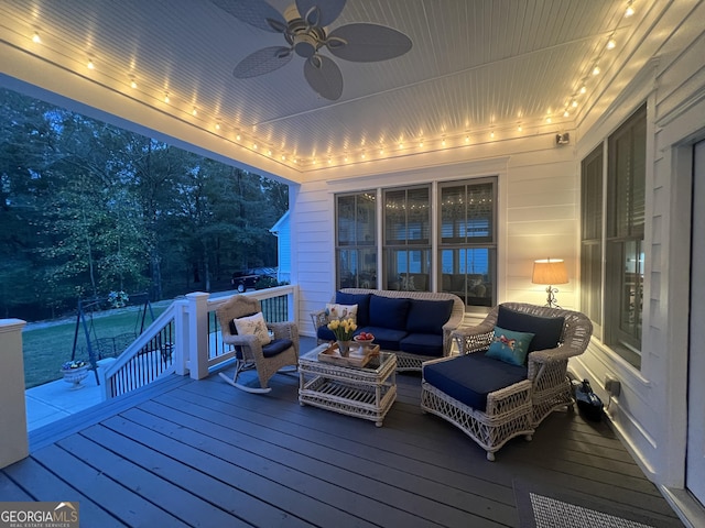 wooden terrace featuring an outdoor hangout area and ceiling fan