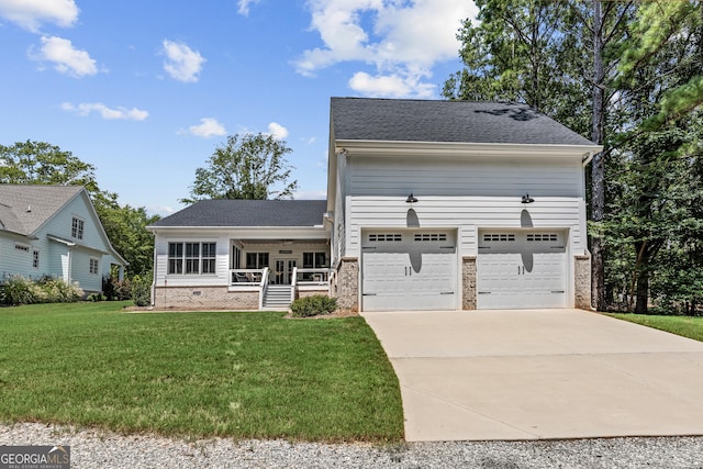 view of front of house featuring a garage, a front lawn, and a porch