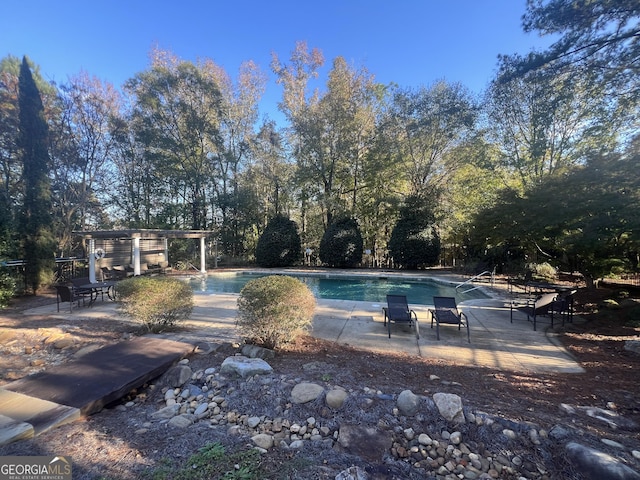 view of swimming pool featuring a patio area