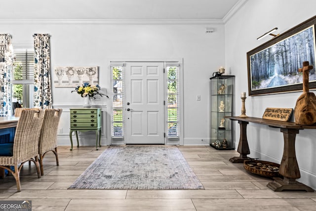 foyer featuring crown molding