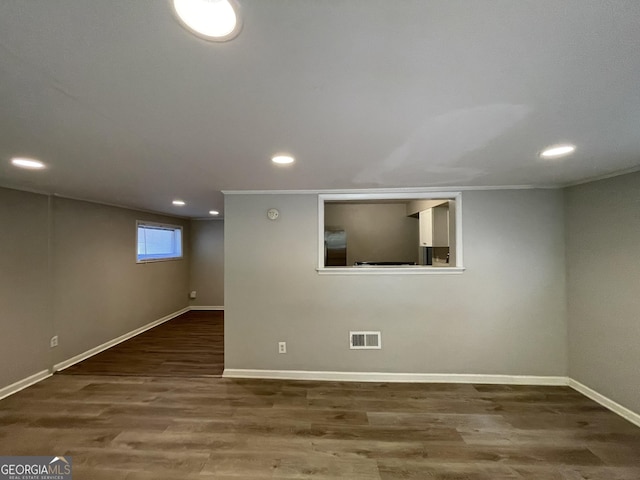 basement featuring dark wood-type flooring