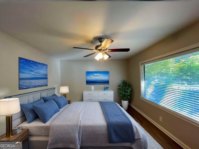 spare room featuring dark hardwood / wood-style floors and ceiling fan