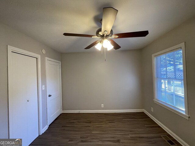 full bathroom featuring vanity, shower / washtub combination, tile walls, hardwood / wood-style floors, and toilet