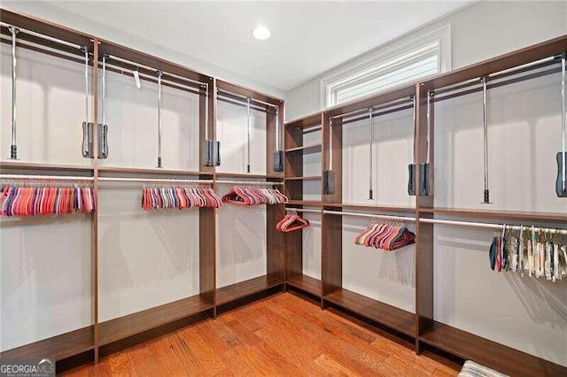 spacious closet featuring light hardwood / wood-style flooring