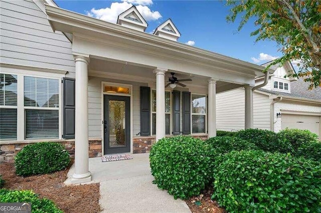 entrance to property with ceiling fan and a porch