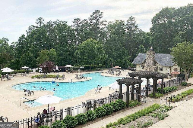 view of swimming pool with a patio area