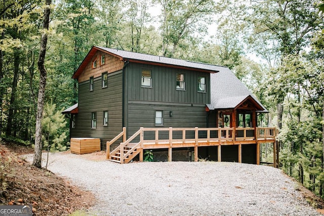 view of front facade with a wooden deck