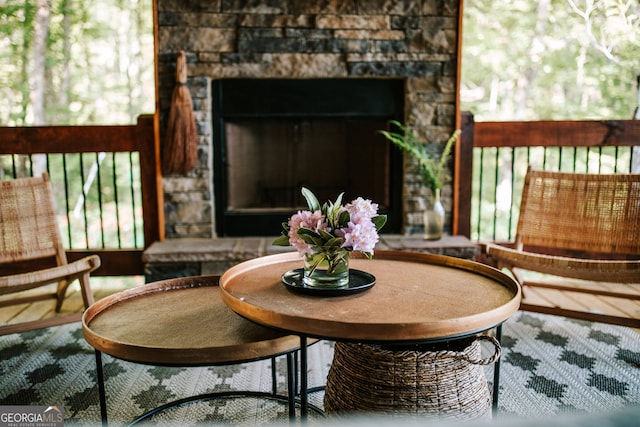 sitting room featuring a fireplace and wood-type flooring