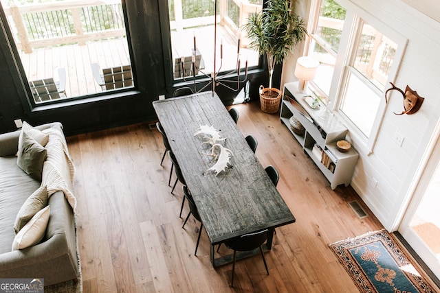 interior space featuring wood walls and hardwood / wood-style floors