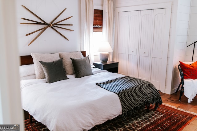 bedroom featuring a closet and hardwood / wood-style flooring