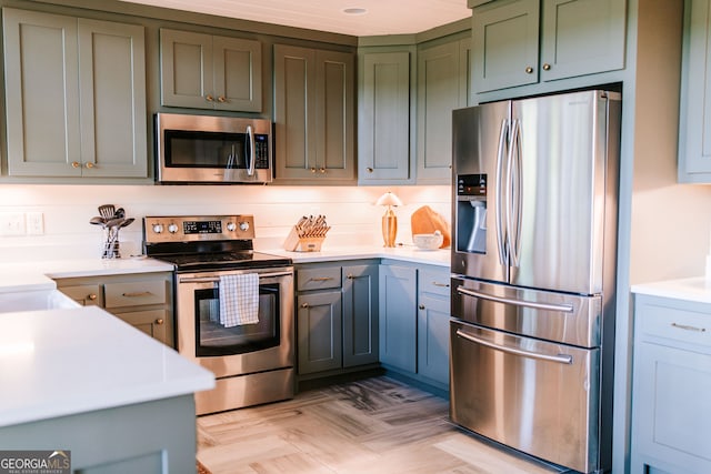 kitchen featuring decorative backsplash and appliances with stainless steel finishes