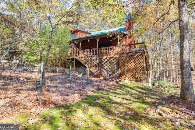 back of house featuring a deck