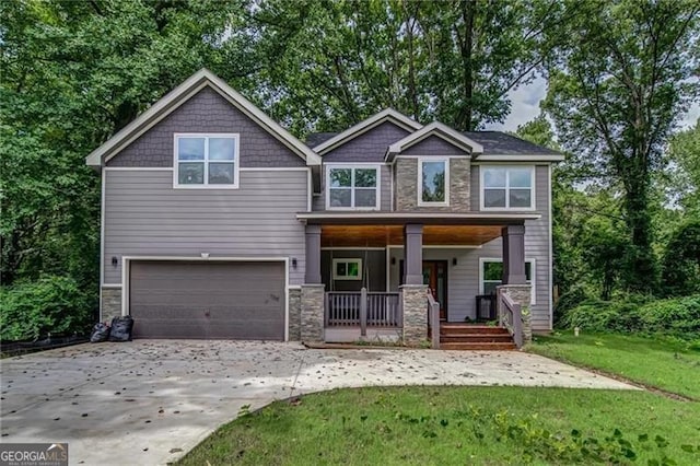 view of front facade with a garage, covered porch, and a front lawn