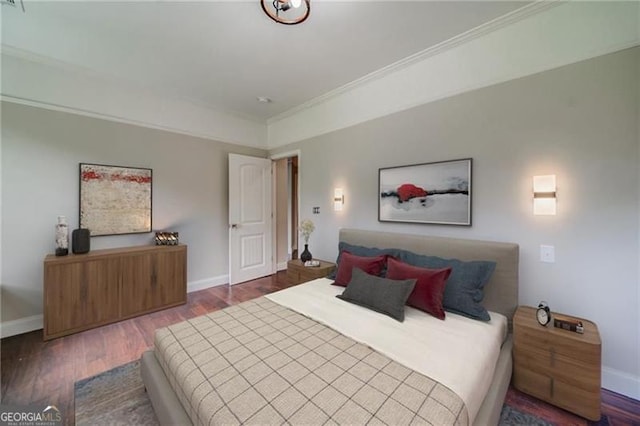 bedroom featuring hardwood / wood-style floors and ornamental molding