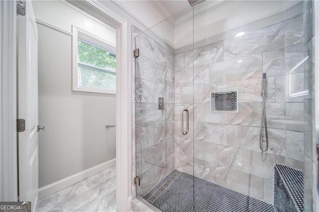 bathroom featuring crown molding and an enclosed shower