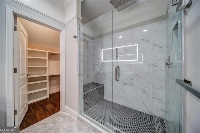 bathroom with hardwood / wood-style floors and a shower with door