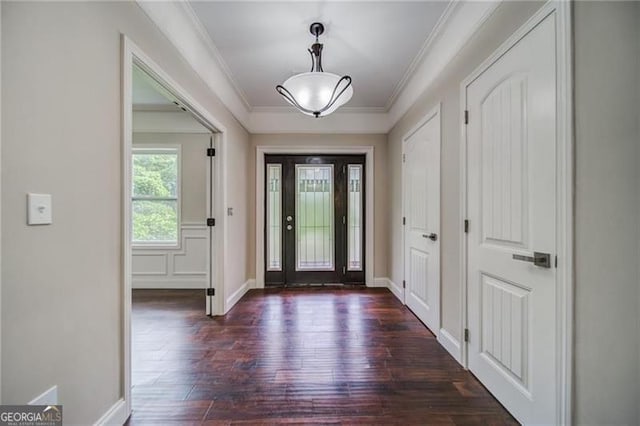 entryway featuring dark hardwood / wood-style flooring and ornamental molding