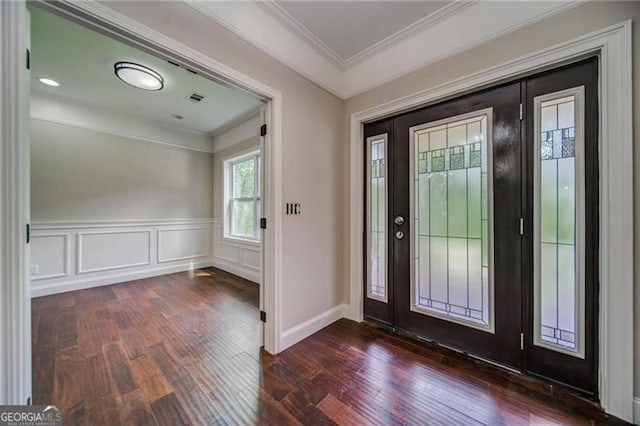 foyer featuring dark hardwood / wood-style floors and ornamental molding