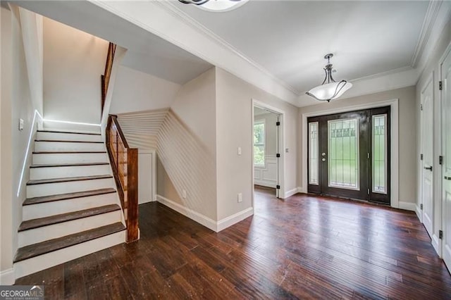 entryway featuring dark hardwood / wood-style flooring and crown molding