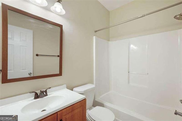 full bathroom with vanity, toilet, and shower / bathtub combination