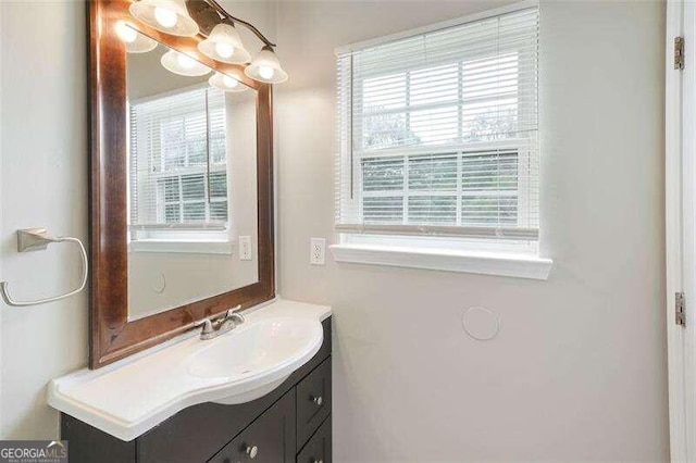 bathroom with vanity and a wealth of natural light