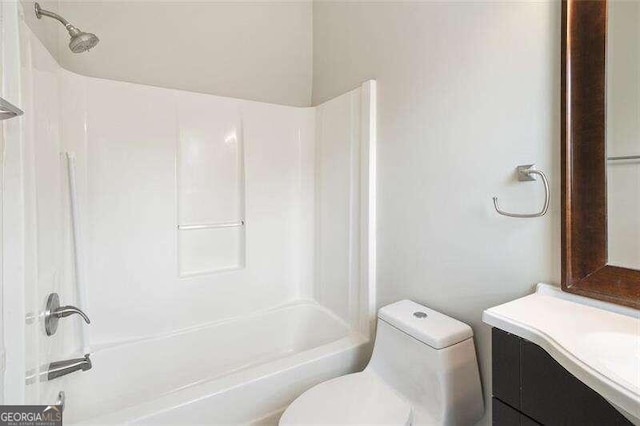 full bathroom featuring shower / tub combination, vanity, and toilet