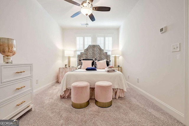 bedroom with light colored carpet and ceiling fan