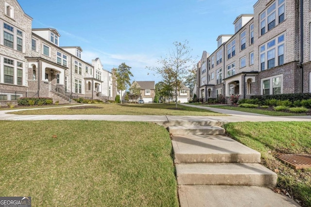 view of community featuring a lawn