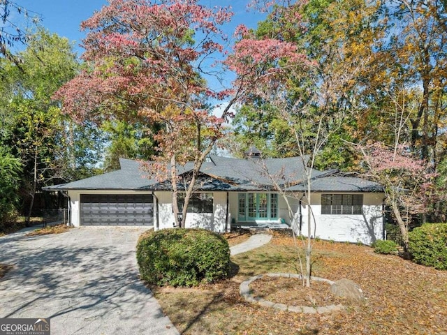 single story home with a garage