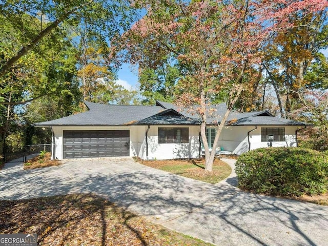 single story home with a garage