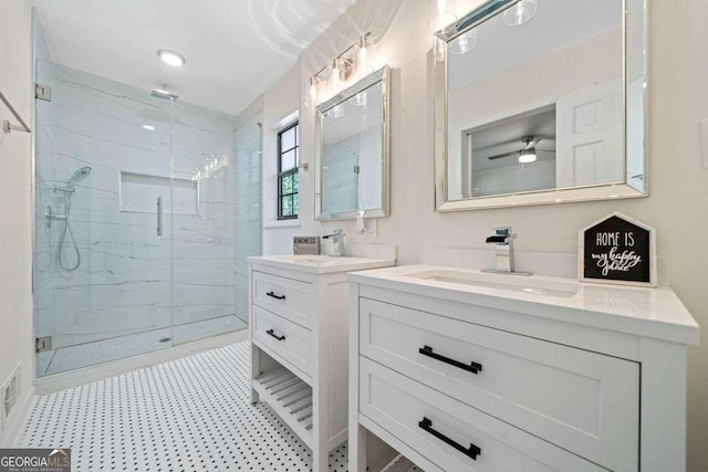 bathroom with ceiling fan, vanity, and walk in shower