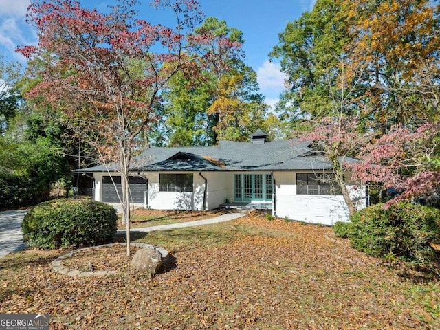 ranch-style home with a garage