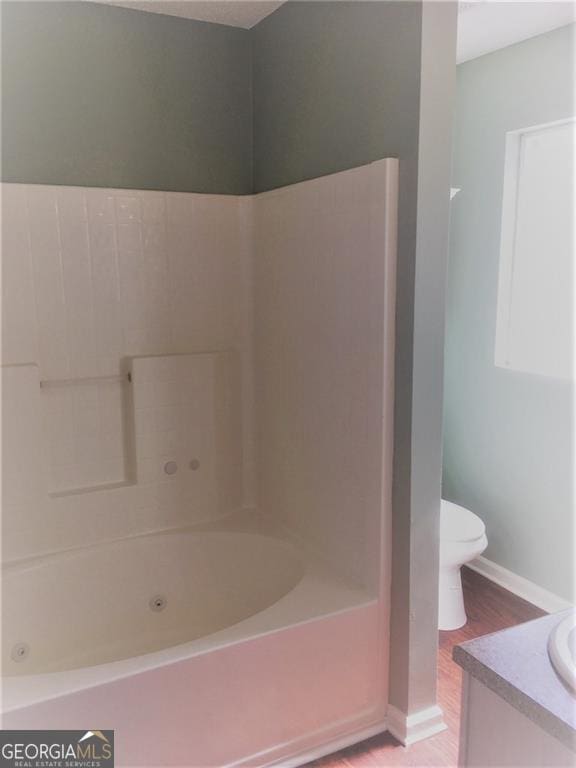 full bathroom with vanity, shower / bathtub combination, toilet, and wood-type flooring