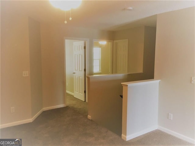 empty room featuring light colored carpet