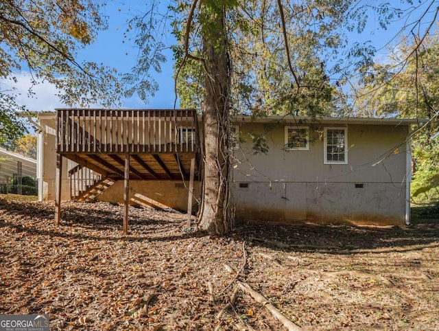 2887 Rockcliff Rd SE, Atlanta, GA 30316 - view of property exterior with crawl space, a deck, and stairs