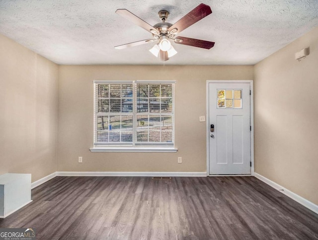 2887 Rockcliff Rd SE, Atlanta, GA 30316 - entryway with wood finished floors, ceiling fan, a textured ceiling, and baseboards