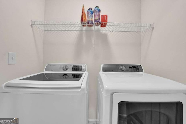 laundry area featuring independent washer and dryer