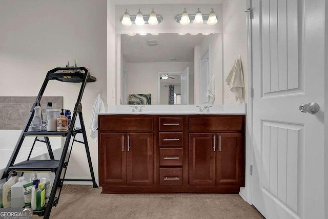 bathroom featuring ceiling fan and vanity