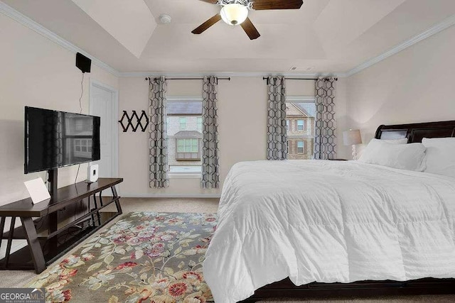 carpeted bedroom with multiple windows, ornamental molding, and ceiling fan