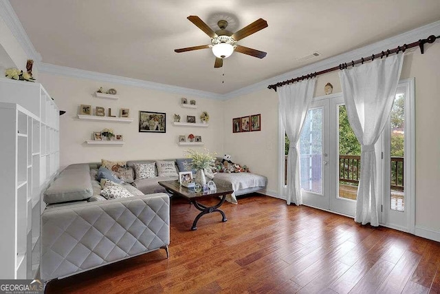 living room with ceiling fan, hardwood / wood-style floors, and ornamental molding