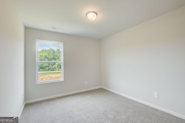 empty room with carpet flooring