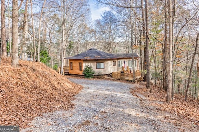 view of property exterior featuring a deck