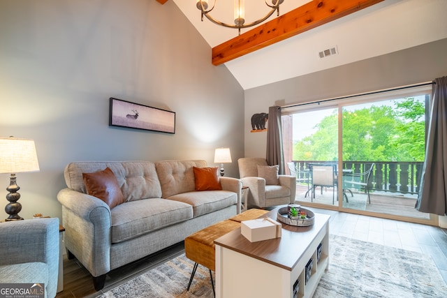 living room with hardwood / wood-style floors, a notable chandelier, beam ceiling, and high vaulted ceiling