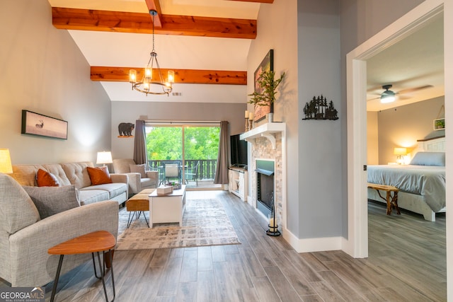 living room featuring beamed ceiling, wood-type flooring, ceiling fan with notable chandelier, and high vaulted ceiling