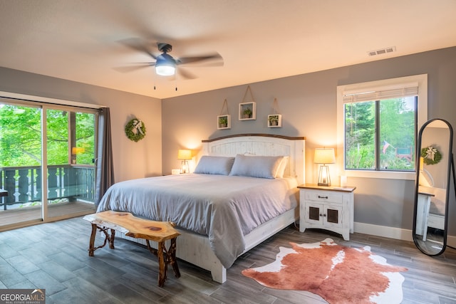 bedroom with hardwood / wood-style flooring, ceiling fan, and access to exterior