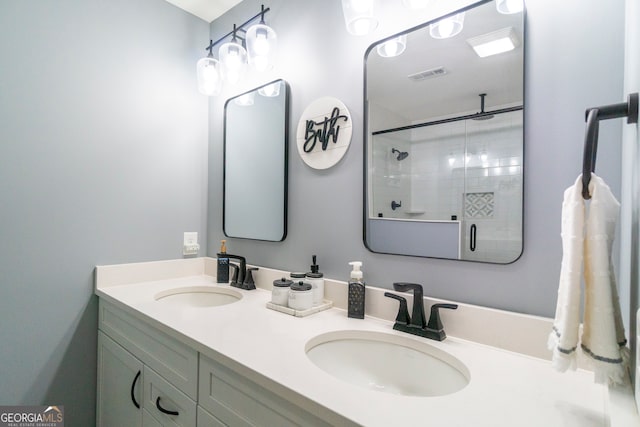 bathroom featuring vanity and tiled shower