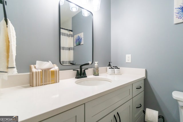 bathroom with vanity and toilet